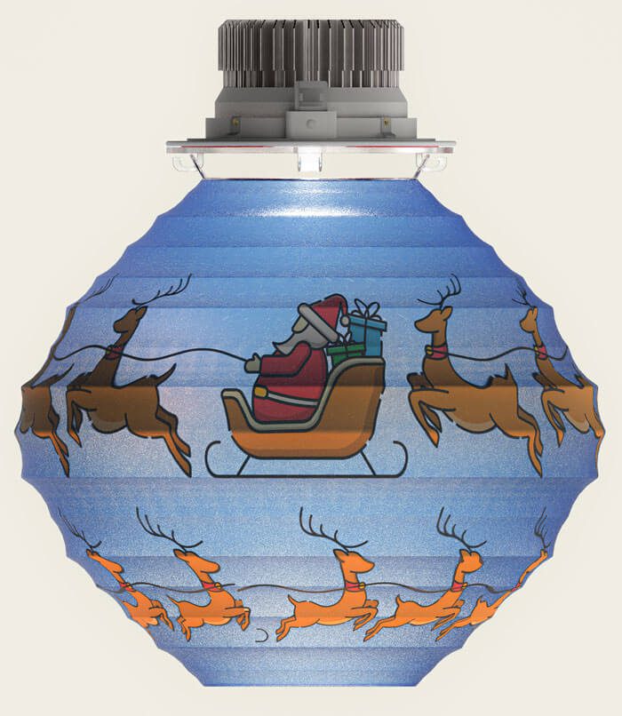 A christmas ornament with santa and reindeer on it.