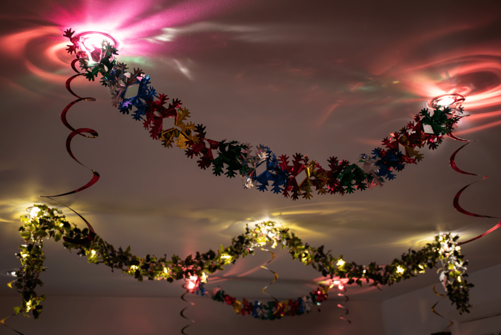 A room with lights and decorations on the ceiling.