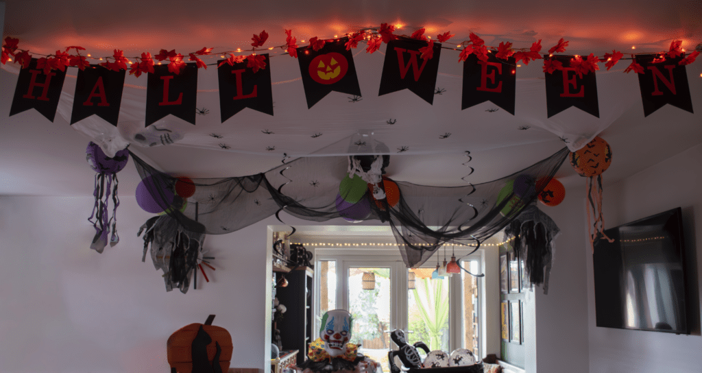 A room decorated for halloween with decorations and lights.