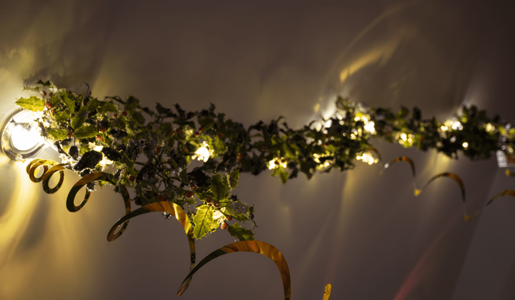 A close up of some lights and leaves